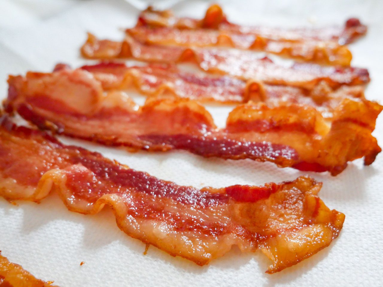 Cooked bacon on sheet pan. 