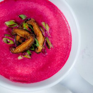 Beet soup in white bowl