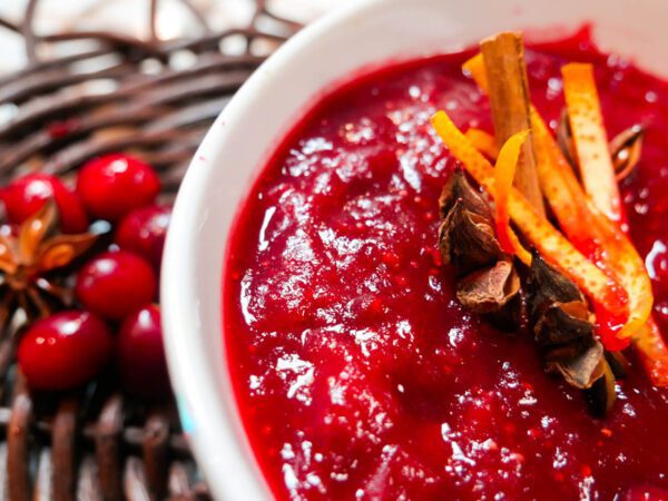 Blood orange cranberry sauce in a bowl on a placemat