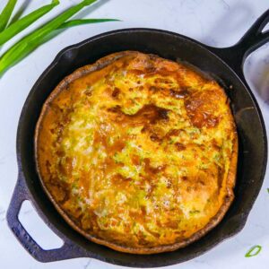 Scallion dutch baby in cast iron skillet