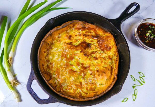 Scallion dutch baby in cast iron skillet