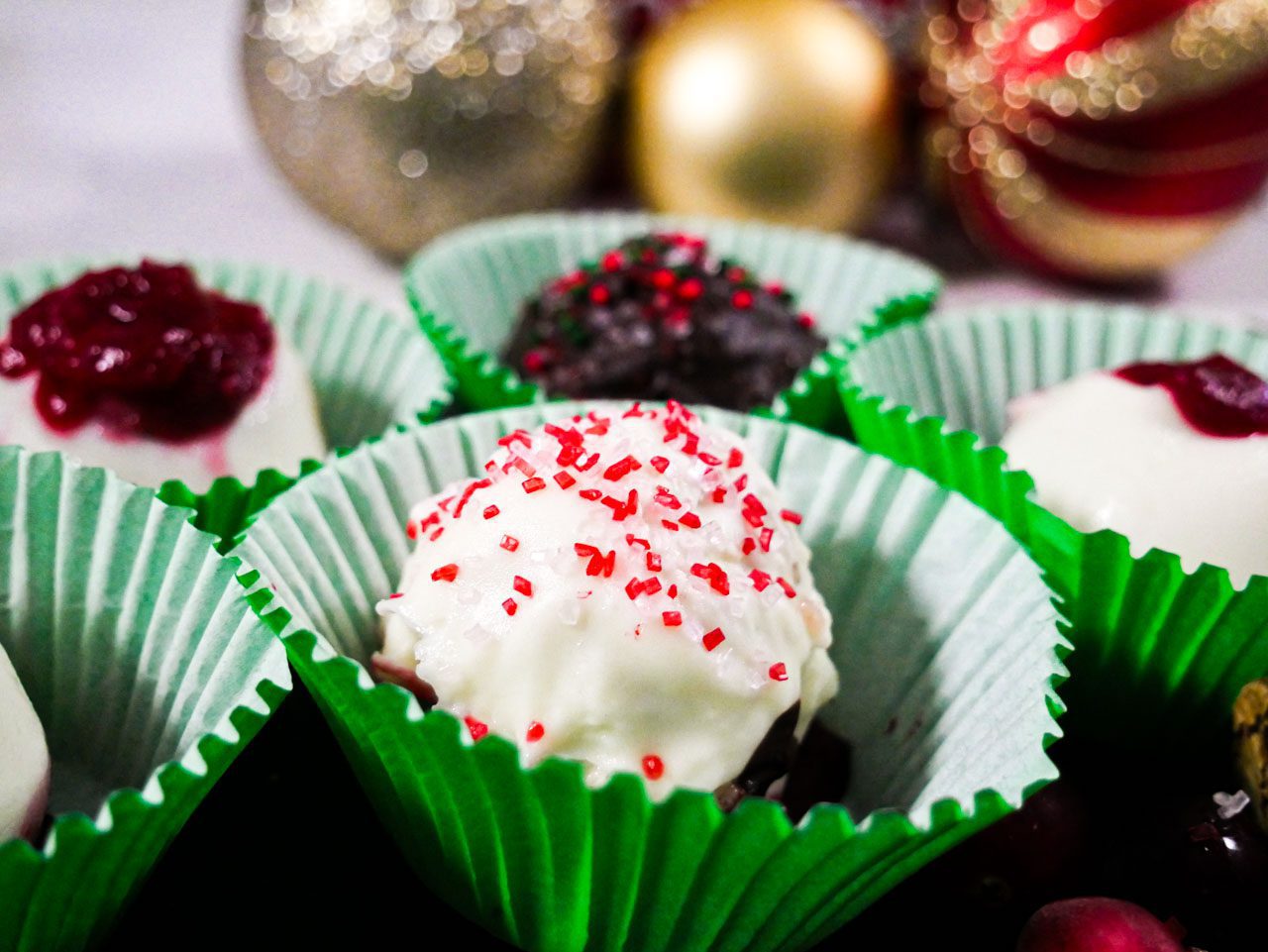 Cranberry gingerbread confection balls with varying decorations