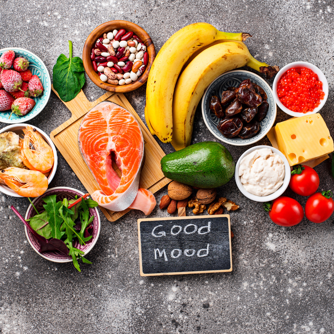 Various healthy good food groups with a sign that says good mood.