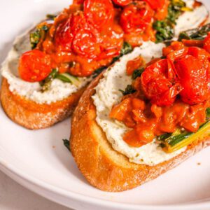 Savory Breakfast Lentil Open-faced Sandwich stacked side by side on a white plate