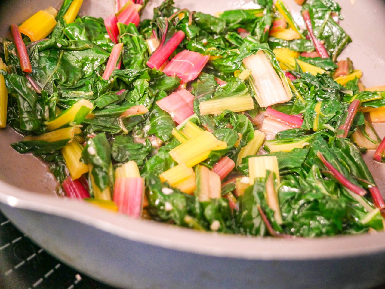 Cooked rainbow chard in a pan