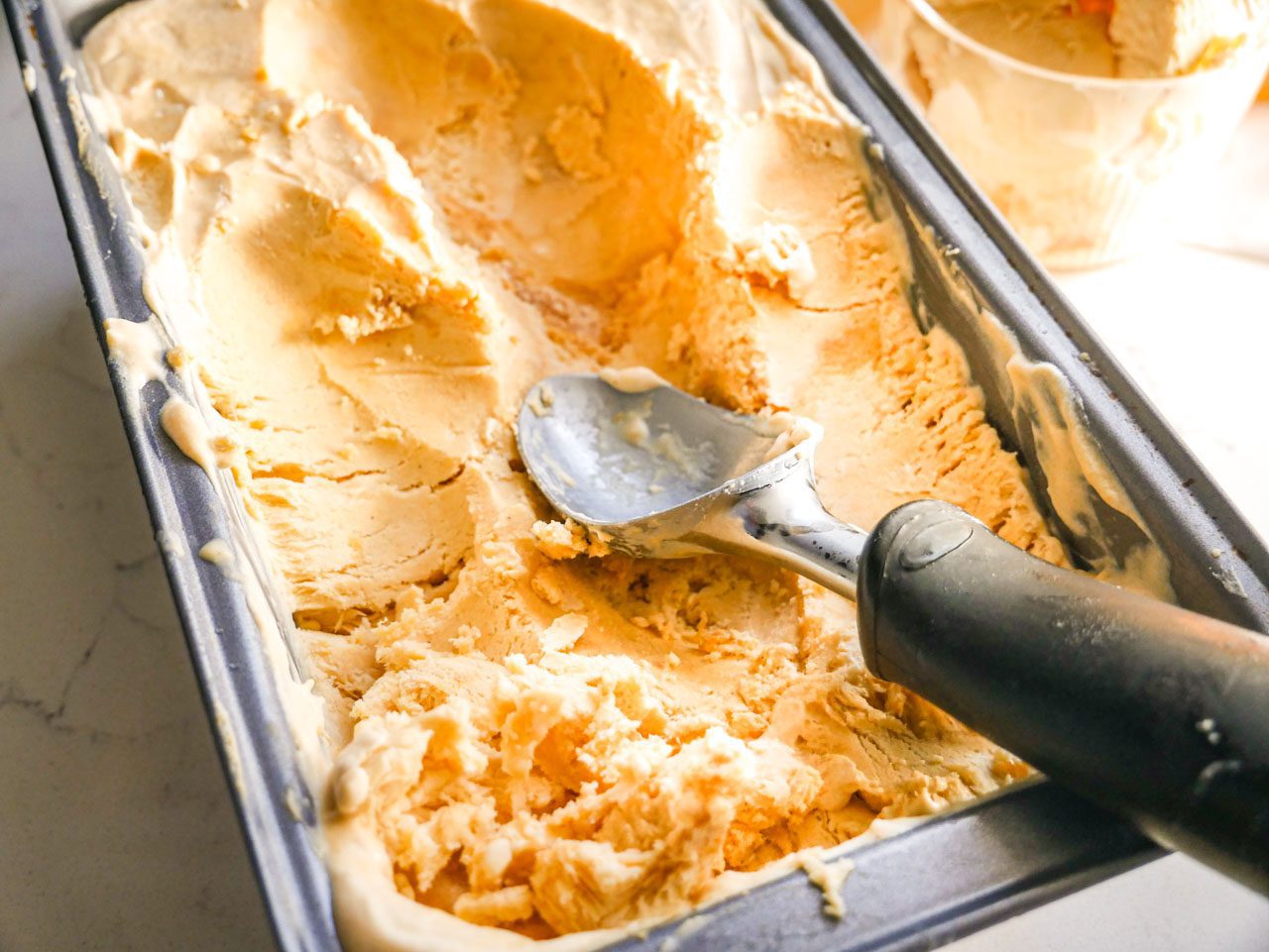 Sweet Potato ice cream scooped out of a loaf pan