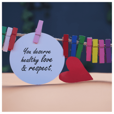 Self-respect in a relationship - clothesline with multcolored clothespins on it and a note in the shape of a white circle that says "you deserve healthy love and respect."