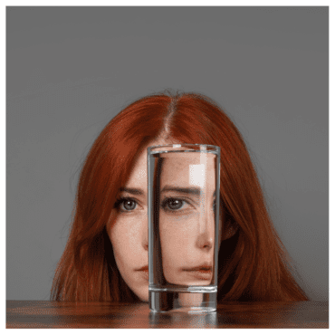 Emotional reactivity signified by this one looking through a water glass with two different expressions